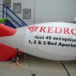 Rented site marking blimp with signage