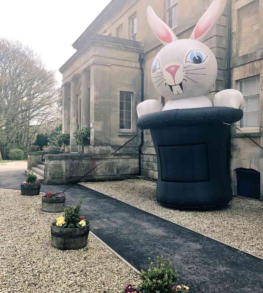 giant inflatable rabbit emerging from top hat